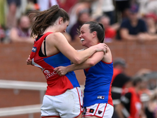 Melbourne captain Daisy Pearce celebrates the Demons’ AFLW flag.