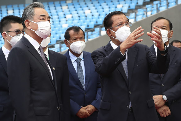 Hun Sen, right, hosts Chinese Foreign Minister Wang Yi, left, in Phnom Penh in September.