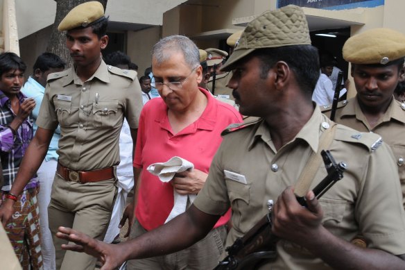Art dealer Subhash Kapoor is brought into court in India in 2012.