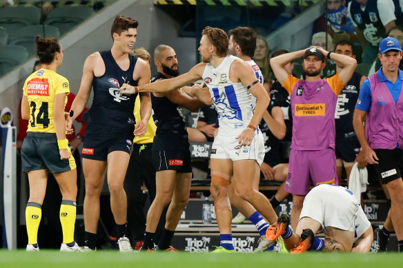 Carlton’s Lewis Young (right) had his one-match ban for bumping North Melbourne’s Cam Zurhaar (on ground) overturned at the tribunal.