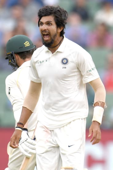 On the frontline: Ishant Sharma enjoys the wicket of Travis Head.