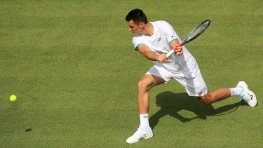 Bernard Tomic's Wimbledon campaign took less than an hour to fizzle out in a straight-sets loss to Jo-Wilfried Tsonga.
