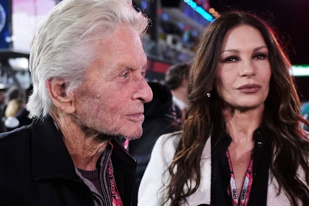 Michael Douglas and Catherine Zeta-Jones walk the course before the Formula One Las Vegas Grand Prix auto race, Saturday, Nov. 22, 2025 in Las Vegas. (AP Photo/Eric Gay)
