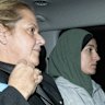 Janai Safar (right) is taken to Mascot police station after arriving at Sydney airport from Doha.