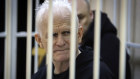 Ales Bialiatski, the head of Belarusian Vyasna rights group, sits in a defendants’ cage during a court session in January.
