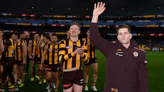 Luke Breust waves to the crowd after his last home game for the Hawks.