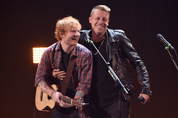 Singer/songwriter Ed Sheeran (L) and rapper Macklemore perform onstage during the 2014 iHeartRadio Music Festival at the MGM Grand Garden Arena on September 20, 2014 in Las Vegas, Nevada