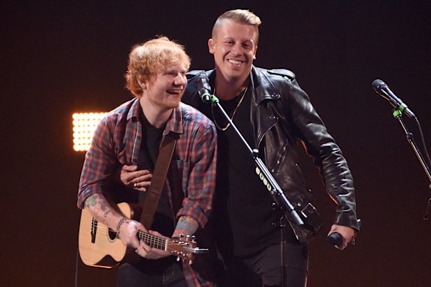 Singer/songwriter Ed Sheeran (L) and rapper Macklemore perform onstage during the 2014 iHeartRadio Music Festival at the MGM Grand Garden Arena on September 20, 2014 in Las Vegas, Nevada