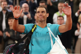 PARIS, FRANCE - MAY 27: Rafael Nadal of Spain waves to the crowd as he walks off after his defeat by Alexander Zverev of Germany in the Men’s Singles first round match on Day Two of the 2024 French Open at Roland Garros on May 27, 2024 in Paris, France. (Photo by Clive Brunskill/Getty Images)