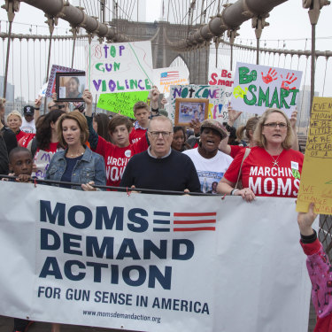 Mothers (and a father) opposing guns walk across the Brooklyn Bridge.