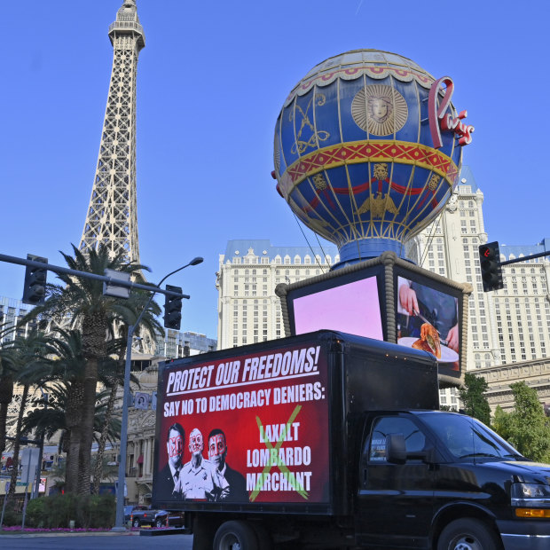 Ahead of the midterm elections, a mobile billboard travels down the Las Vegas Strip on Friday.