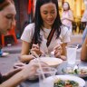 A group of multi-ethnic female friends enjoying street food on Yaowarat Road or Chinatown in Bangkok, Thailand. iStock image for Traveller. Re-use permitted.