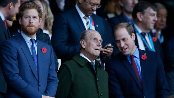 Prince Harry, Prince Philip and Prince William at a rugby match in 2015. 