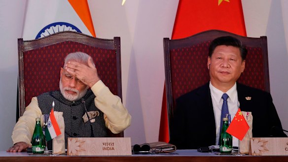 Indian Prime Minister Narendra Modi, left, and Chinese President Xi Jinping attend the BRICS summit in Goa, India, in 2016.