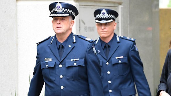 Superintendent Peter Ward (right) and Assistant Commissioner Michael Grainger arrive at the Coroner's Court on Monday.