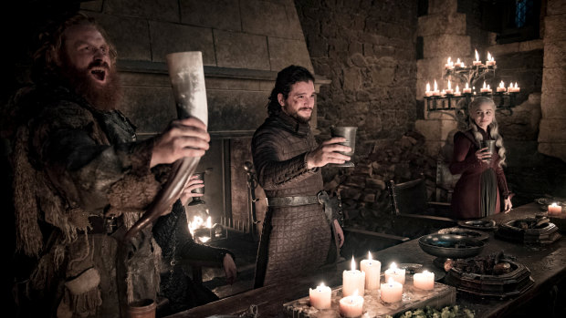 Earlier in the same scene: a toast, and no sign of Emilia Clarke's coffee cup.