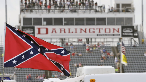 A Confederate flag flies in the infield before a NASCAR Xfinity auto race at Darlington Raceway in South Carolina in 2015. 