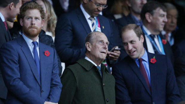 Prince Harry, Prince Philip and Prince William at a rugby match in 2015. 