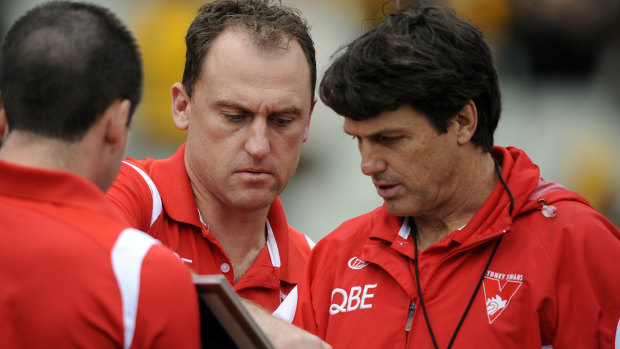 Then Swans assistant John Longmire with coach Paul Roos at quarter-time of a game against Hawthorn in 2010.