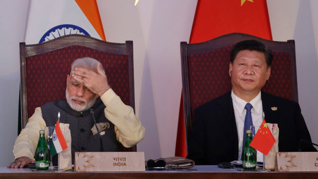 Indian Prime Minister Narendra Modi, left, and Chinese President Xi Jinping attend the BRICS summit in Goa, India, in 2016.