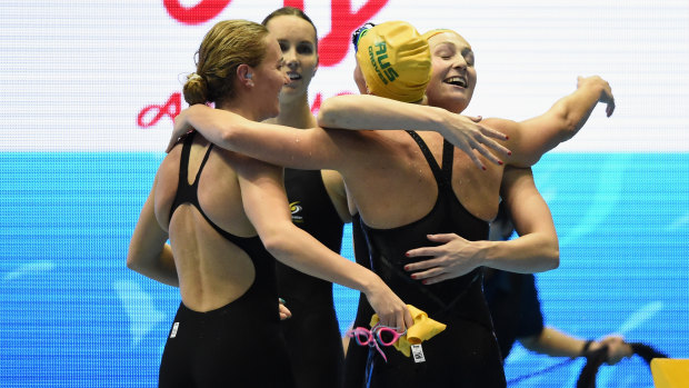 Camaraderie: Ariarne Titmus, Emma McKeon, Madeline Groves and Mikkayla Sheridan embrace after earning bragging rights over the Americans.