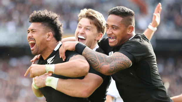 Ardie Savea, Beauden Barrett and Shannon Frizell celebrate a try in game two. 