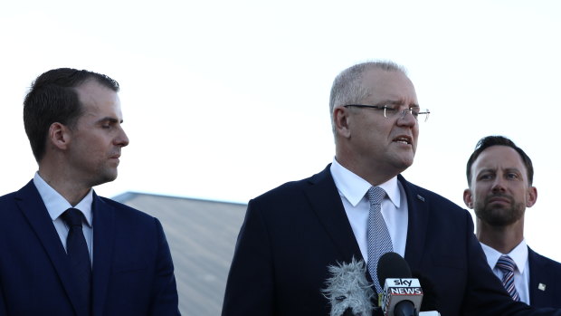 Prime Minister Scott Morrison, flanked by the Liberal candidate for Cowan Isaac Stewart and Liberal candidate for Stirling Vince Connelly.