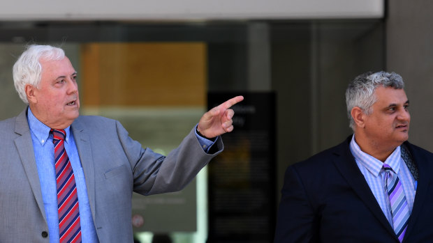 Clive Palmer's lawyer Sam Iskander (right) said at least 20 claims totalling around $450,000 had been paid from a $7 million trust account established earlier this month.