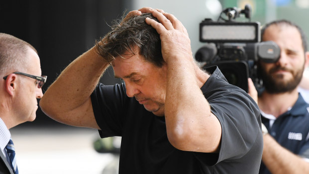 Queensland sports psychologist Sean Lynch is seen after leaving the police watch house in Brisbane.