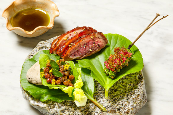 Dry-aged duck, garden green sichuan peppercorn, muntari; duck leg, charred herbs, and finger lime.