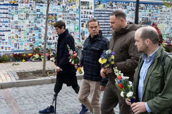 News Corp chairman Lachlan Murdoch (centre) in Kyiv alongside injured Fox News journalist Ben Hall (left).