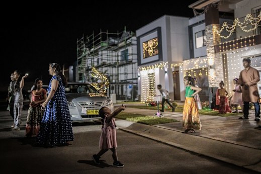 Residents decorate their homes ahead of the Diwali festival last year.