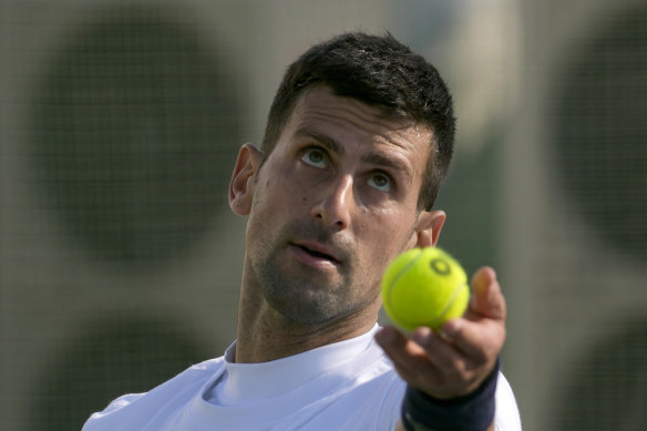 Novak Djokovic serves the ball.