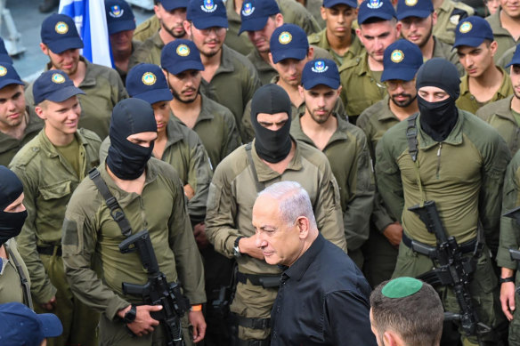 Israeli Prime Minister Benjamin Netanyahu meets navy personnel.