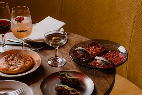 Tortilla, croquettas and raw beef carpaccio. 