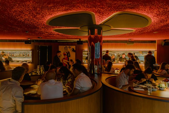Besa squeezes 65 seats into a tight space of “moody” red tones, spotted gum timber and circular booths.