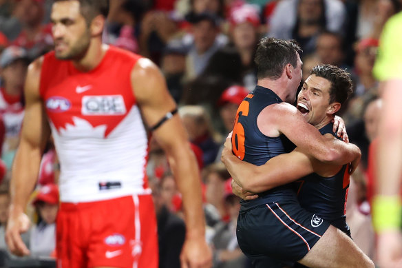 Brent Daniels and Josh Kelly celebrate after the Giants’ late goal at the SCG.
