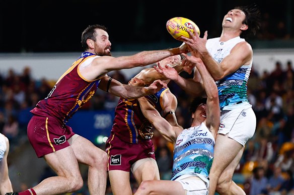 Jack Henry and Darcy Gardiner compete for the ball.