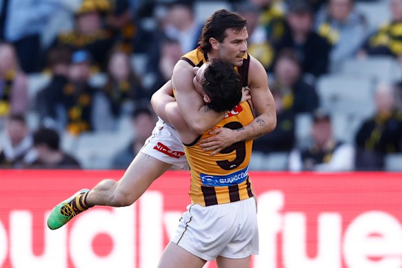 Connor Macdonald and Nick Watson celebrate the Hawks' big win against Richmond.