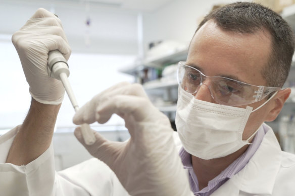 Researcher Nicolas Barthelemy works on a p-tau217 test for Alzheimer's disease. 