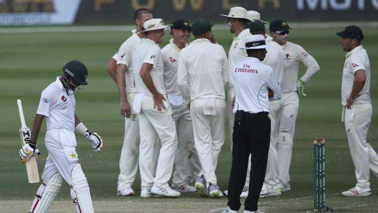 Near miss: Pakistan's Babar Azam, left, walks off after being dismissed for 99.