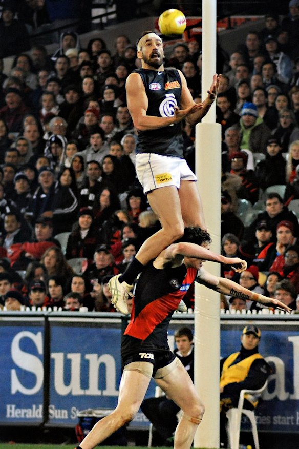 Andrew Walker takes a screamer for Carlton.