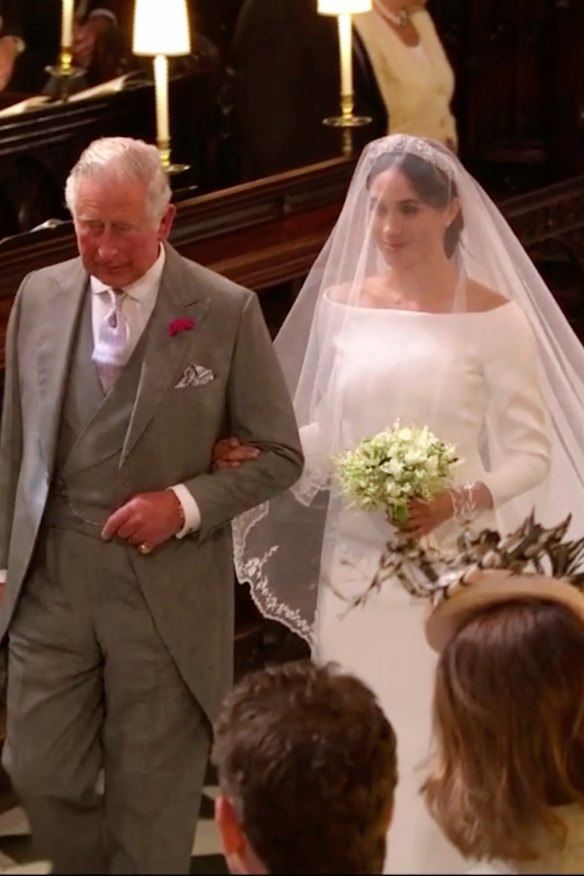 Meghan Markle walks down the aisle with Prince Charles.