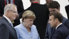 French President Emmanuel Macron and German Chancellor Angela Merkel must strike a deal on carving up the top jobs in Brussels.