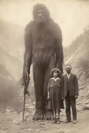 AI-generated art created by Dan Lytle, an artist who works with AI and runs a TikTok account called The_AI_Experiment. Lytle used Midjourney to create a vintage picture of a giant Neanderthal standing among normal men. It produced this aged portrait of a towering, Yeti-like beast next to a quaint couple.
