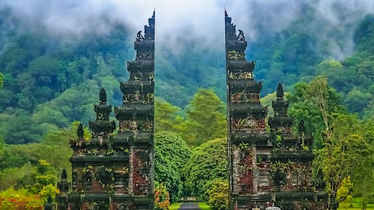 A gate to a Hindu temple, set amid jungle.