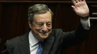 Italian PM Mario Draghi waves to MPs at the end of his address at the Parliament in Rome. 