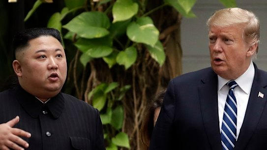 Kim Jong-un and Donald Trump go for a walk in the garden after their first meeting in Hanoi.