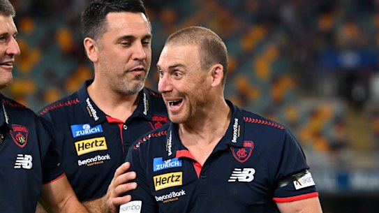 Simon Goodwin has a laugh with his coaching staff.