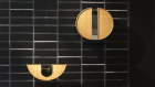 The pieces combine gold, silver and bronze, pristine Plexiglass and natural woven rattan.